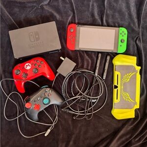 Nintendo Switch Console lot-dock station, controllers, power and HDMI cords.